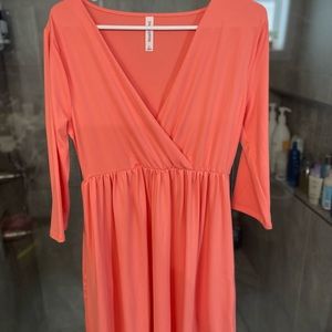 Bright coral midi dress. Not awkwardly long but not short either.